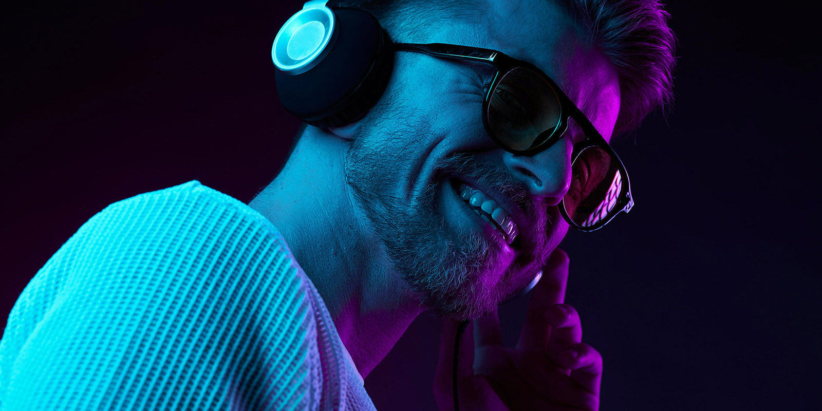 person enjoying music on Bluetooth headphone